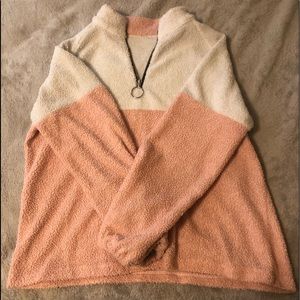 pink and white quarterzip sweater